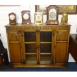 An Old Charm style oak bookcase, 96cm high x 124cm wide