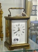 A brass cased carriage clock, Matthew Norman, London, striking on a gong with key, 18cm handle up.