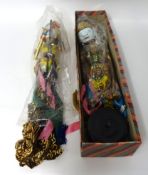 Two Indonesian puppets, boxed, length 58cm.