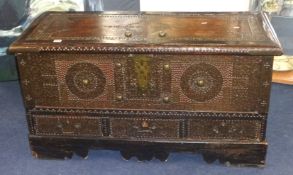 An old Zanzibar chest with brass studwork decoration and fitted with three drawers, 110cm wide