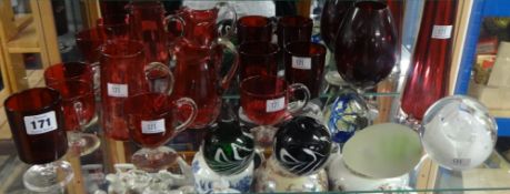 A small collection of various cranberry coloured glass ware also some paperweights (16).