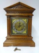 A late Victorian bracket clock, the oak case of architectural form, eight day movement striking on