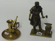 Brass sculpture of a Blacksmith and a brass chamber stick (2).