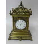 A late Victorian brass ornate 8 day clock, 30cm.