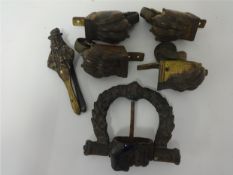 Pair of brass nutcrackers, Antique iron door knocker, Set of antique brass furniture castors.