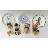 A collection of eight miniature Royal Doulton cricket figures t/w three decorative china plates.