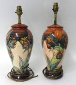 A pair of modern Moorcroft table lamps of baluster shape, height 42cm max.