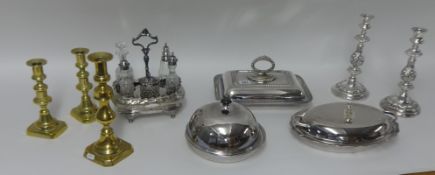 Silver plated wares including candlesticks, cruet set, oval entrée dishes, scalloped dish and cover,