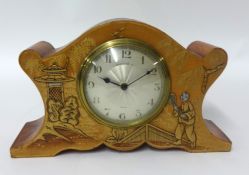 Reproduction clock circa 1940 with orange Chinese lacquered case, 15.5cm.