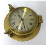 A modern ships bulk head clock with quartz movement.