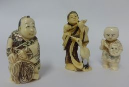 Three carved netsukes.