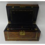 A 19th century walnut writing slope, brass bound, inlaid with brass, with fitted interior