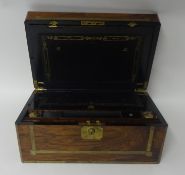 A 19th century walnut writing slope, brass bound, inlaid with brass, with fitted interior