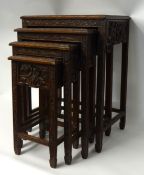 A nest of four Chinese occasional tables of square form.