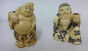 Two carved netsukes.