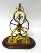 A reproduction brass skeleton clock with glass dome, height 37cm including dome.