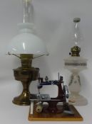 Victorian opaline glass oil lamp, brass oil lamp and a miniature sewing machine with case (3).