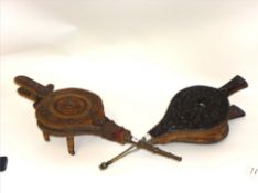 Two antique carved fire bellows.