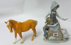 A Beswick Palomino horse and a Lladro figure.