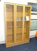 A modern display cabinet in two sections approximately 120cm wide overall.