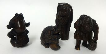 Five carved wood netsukes.