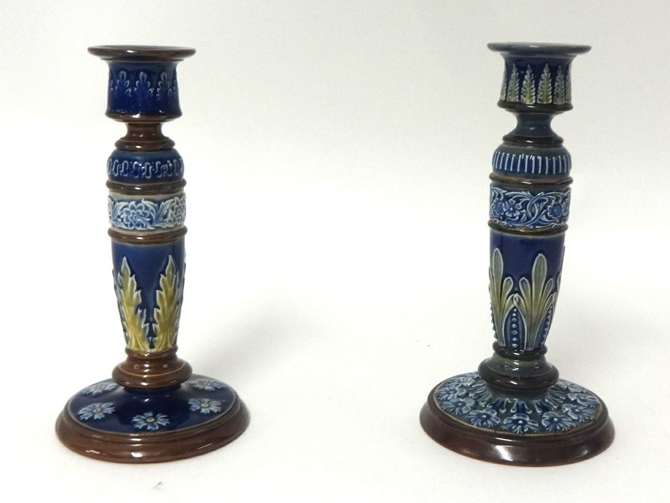 Two Royal Doulton candlesticks, 21cm.