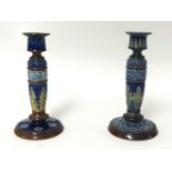 Two Royal Doulton candlesticks, 21cm.