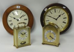 Two brass cased reproduction clocks circa 1970, battery operated t/w two wood cased wall clocks, one