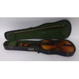 An old violin, cased.