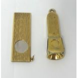A 9ct gold cigar slicer, London 1971, with bark finish and a 9ct gold cigar clipper, London 1966.