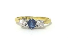 A sapphire and diamond three stone ring claw set with old cut stones, size K 1/2.