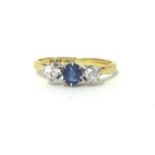 A sapphire and diamond three stone ring claw set with old cut stones, size K 1/2.