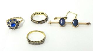 A five stone diamond ring, illusion set, two dress rings and a bar brooch.