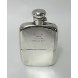 A silver two part hip flask, Birmingham 1923, of rectangular form with bayonet cap, inscribed,
