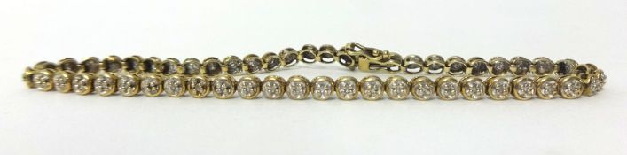 A 9ct gold and diamond line bracelet, set with single cut stones, weight 5.8 grams.