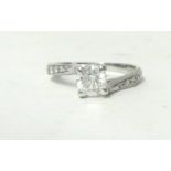 A 14ct white gold and diamond single stone ring, raised claw set with a brilliant cut diamond ring