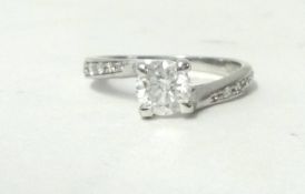 A 14ct white gold and diamond single stone ring, raised claw set with a brilliant cut diamond ring