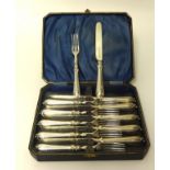 A Victorian silver set of dessert knives and forks, Birmingham 1846, crested and monogrammed, cased.