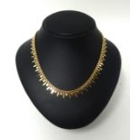 18ct rose gold curb style fringe necklet with oval and circular droplets having a box snap clasp and