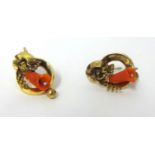 A Victorian pair of gold and coral earrings, of floral scroll design, weight 3.9 grams.