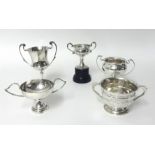 A silver two handled trophy cup, London 1935, inscribed, another London 1924, weight 6 oz, and three