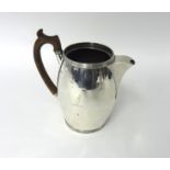 A Victorian silver cordial jug, makers mark overstruck, London 1880, of barrel shape with reeded