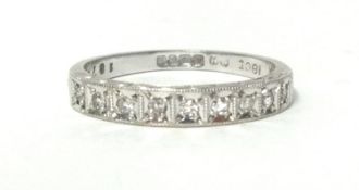 An 18ct white gold and diamond half eternity ring, box set with nine single cut stones, size N 1/2.