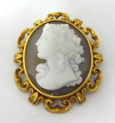 A Victorian gold and hardstone cameo brooch, circa 1870, depicting a classical lady in profile, to a