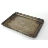 A silver tray, Birmingham 1912, of rectangular form with engraved decoration, 30 x 23 cm, weight
