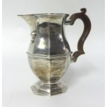 A silver milk jug, Birmingham 1911, of octagonal baluster form, height 13 cm, weight 7 oz.