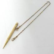 A 9ct gold propelling pencil to a 9ct white and rose gold watch chain, weight of chain 7 grams.