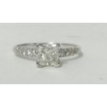 A 14ct white gold and diamond single stone ring, claw set with a princess cut stone weighing