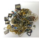 A large quantity of costume jewellery to include necklaces, brooches, rings and earrings.