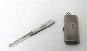 An Edwardian silver novelty sovereign case, Chester 1906, of rectangular form, opening to reveal a
